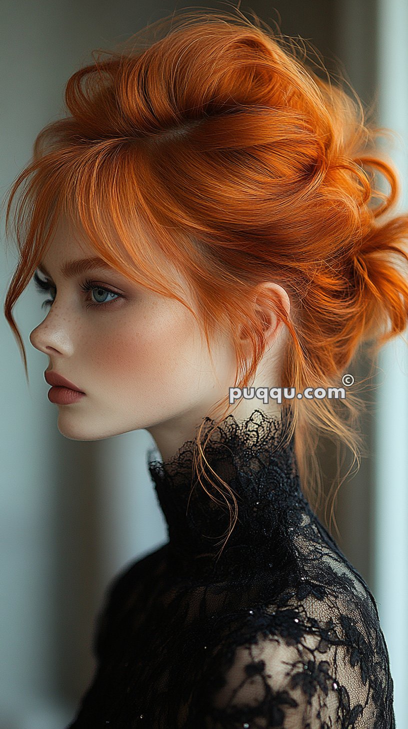 Woman with red hair in an updo, wearing a black lace high-neck blouse.