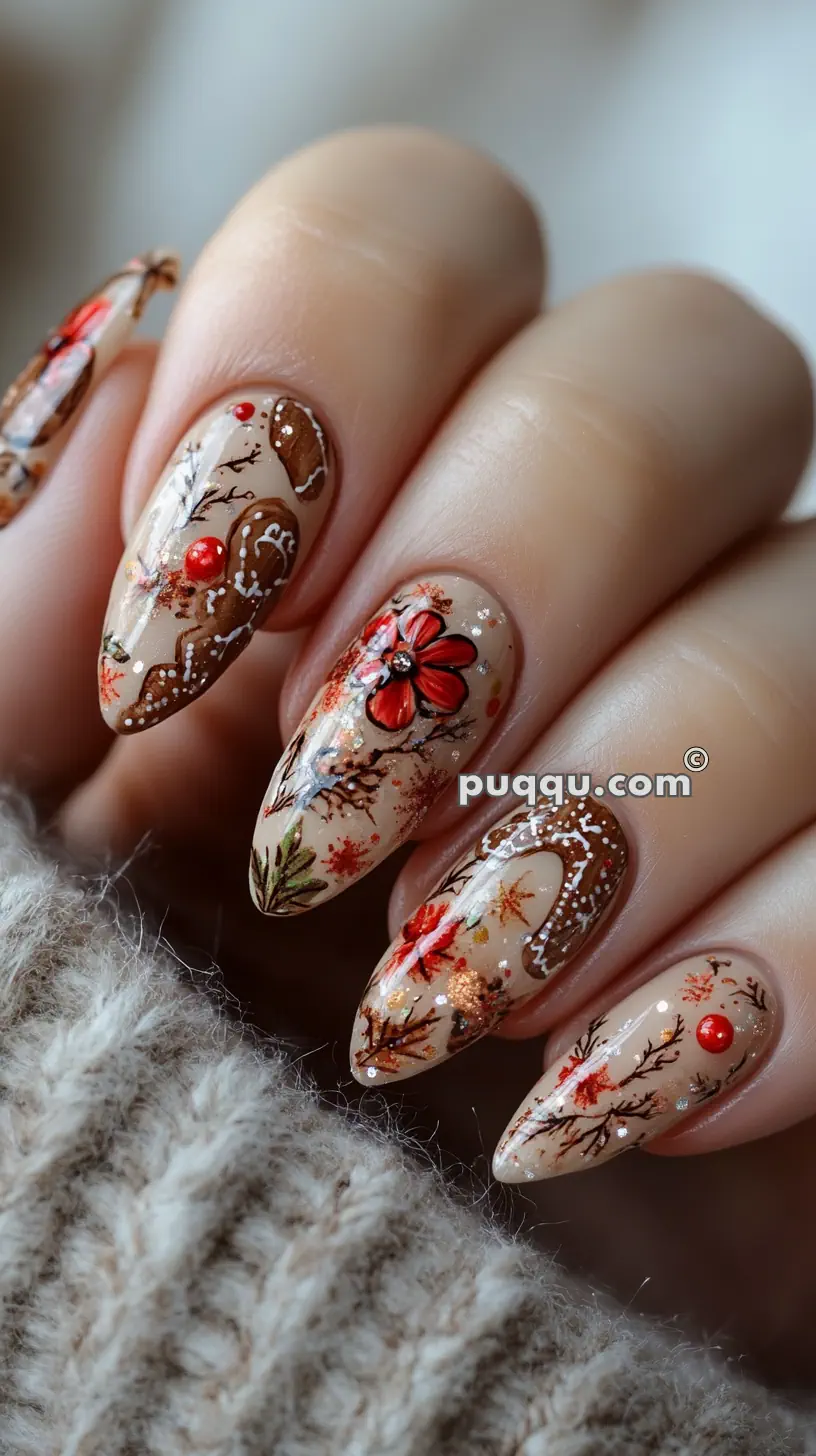 Close-up of nails with intricate autumn-themed nail art featuring red flowers, branches, and decorative patterns against a beige background.