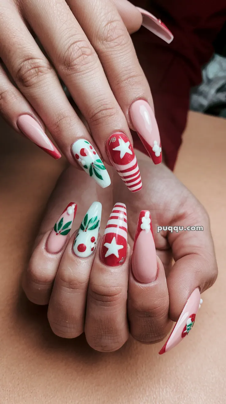 Festive nail art with Christmas-themed designs, including stars, stripes, holly leaves, and berries in red, white, and green on long nails.