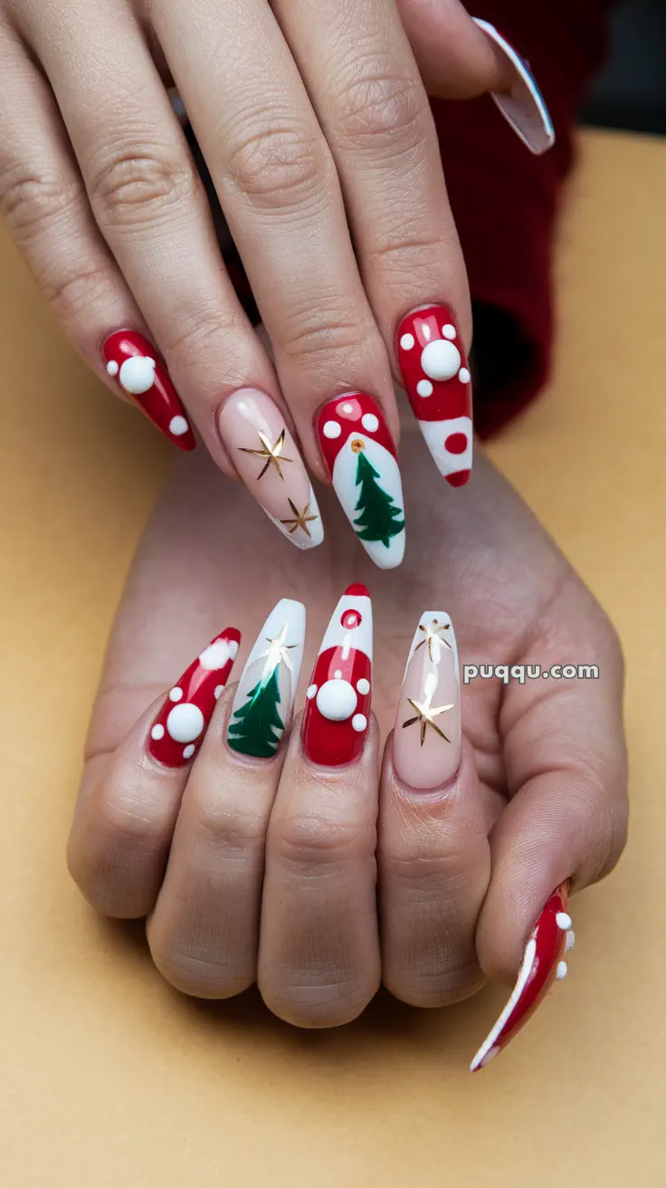 Festive nail art featuring red and white polka dots, Christmas trees, and gold stars on long nails.