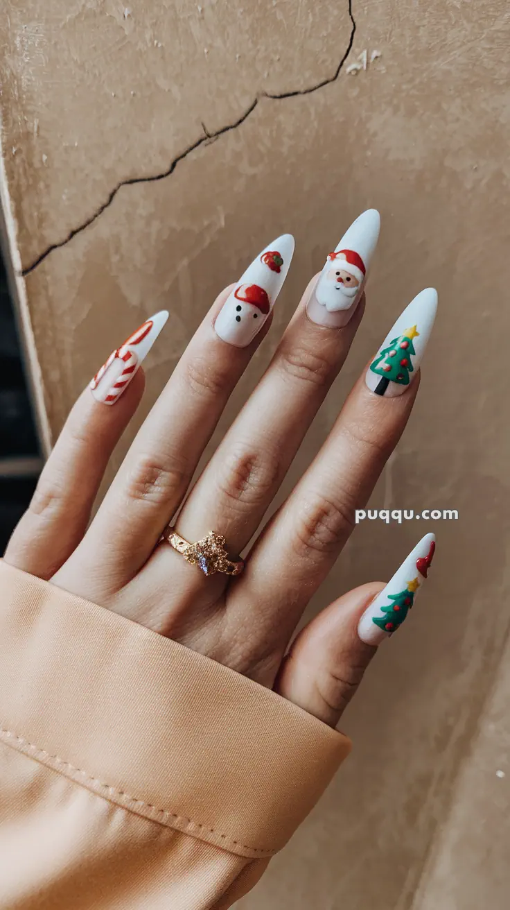 Hand with long, festive Christmas-themed nail art, featuring designs of a candy cane, snowman, Santa Claus, and Christmas tree.