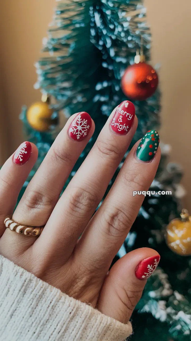 Hand with festive Christmas nail art featuring snowflakes and the phrase "Merry & Bright," in front of a decorated tree with ornaments.