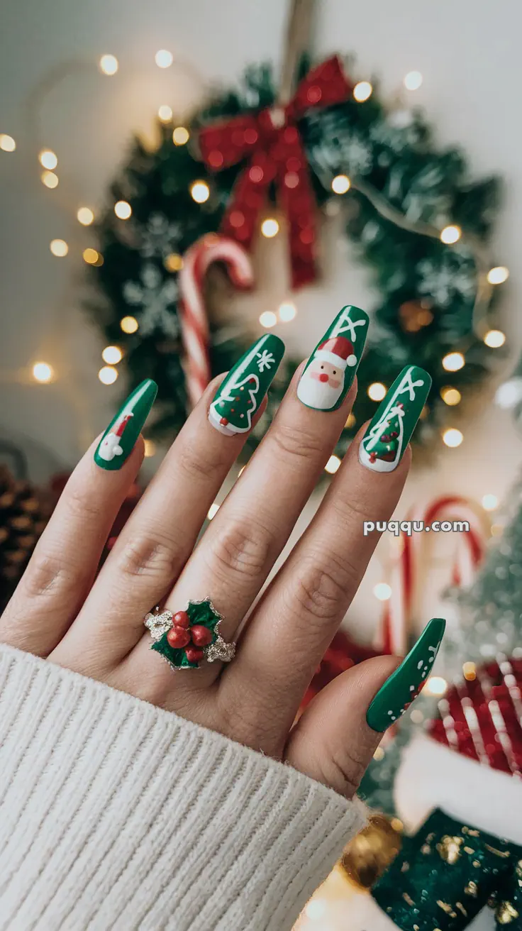 Festive green nails with Christmas-themed designs, including Santa, snowflakes, and Christmas trees, adorned with a holly berry ring, and blurred holiday decorations in the background.