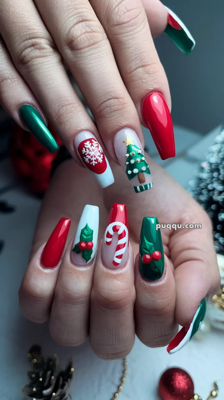 Christmas-themed nail art with designs including a Christmas tree, snowflake, holly, and candy cane on long red, green, and white nails.