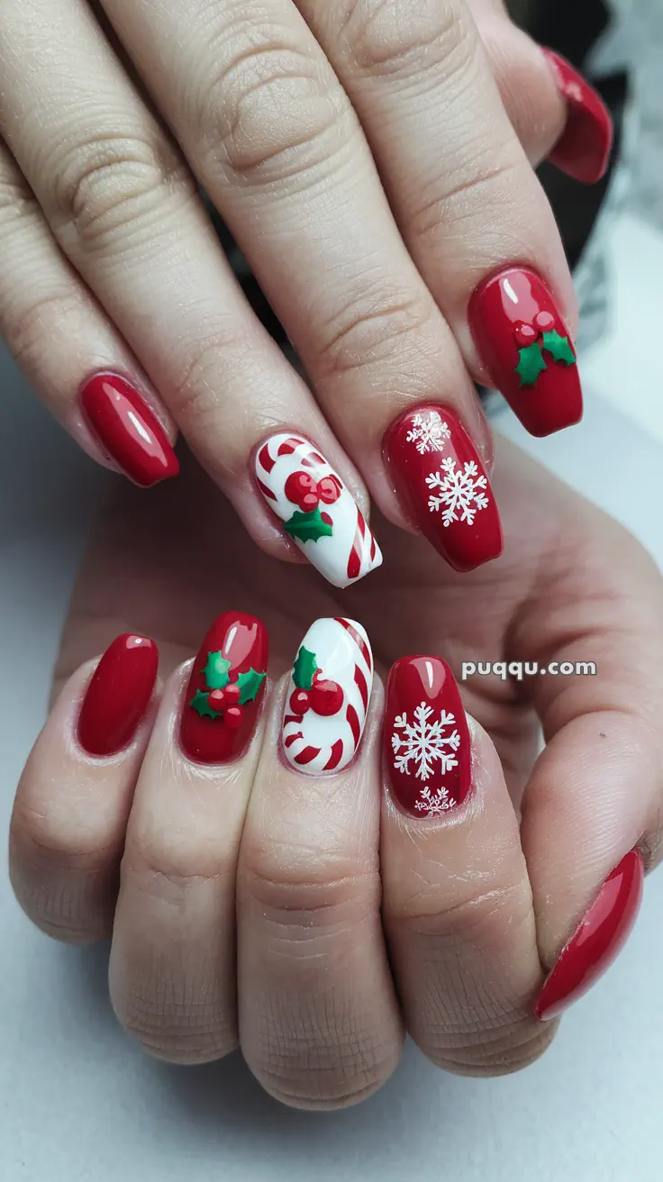 Festive red and white nail art with holly, candy cane stripes, and snowflake designs.