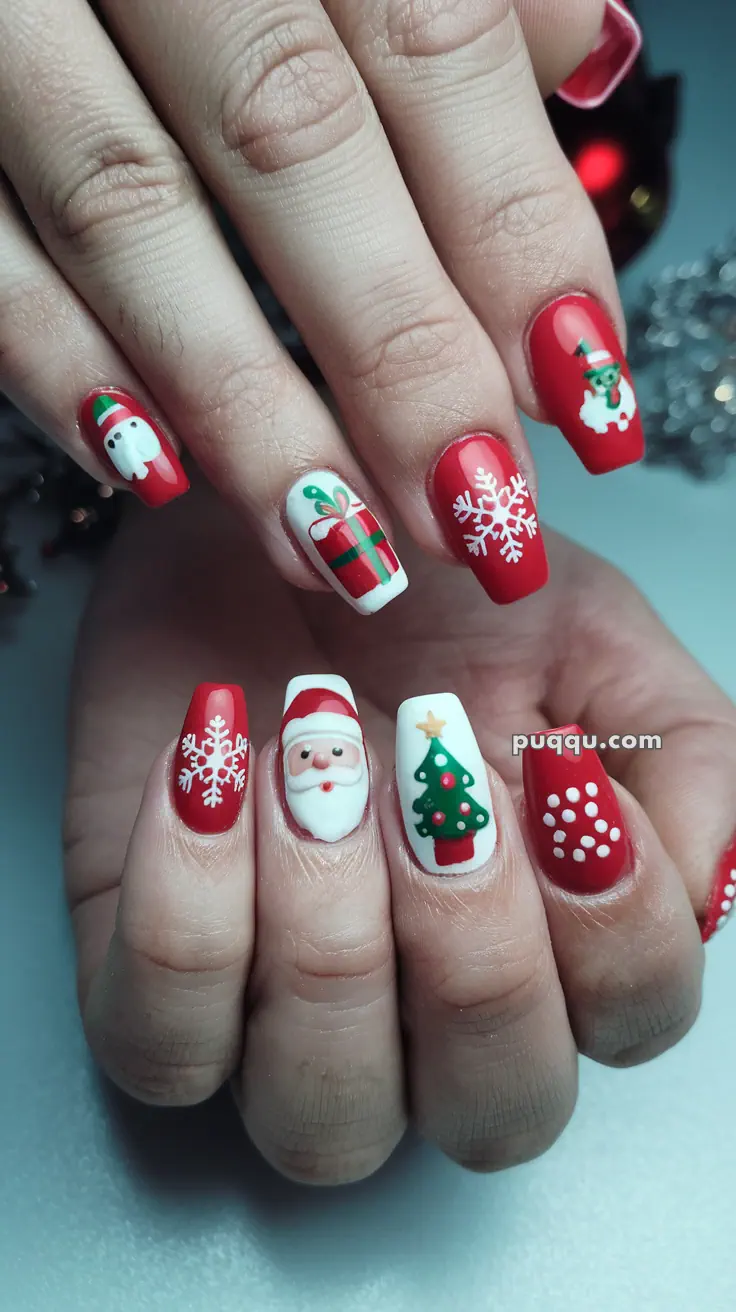 Festive Christmas-themed nail art with red and white designs, including snowflakes, Santa Claus, a Christmas tree, a gift, and polka dots.