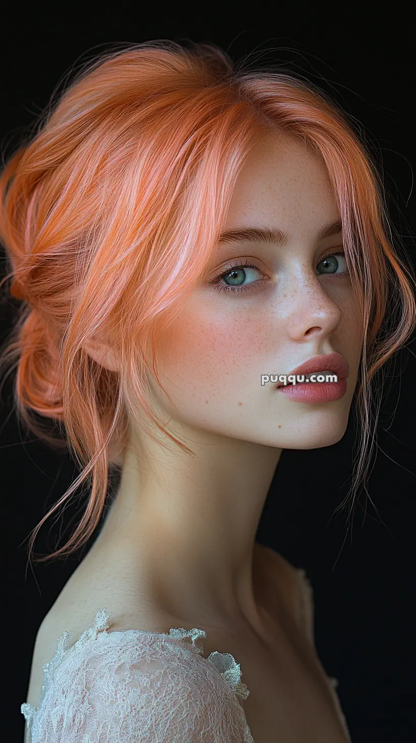 Young woman with peach-colored hair and freckles, wearing a lace top, looking over her shoulder.